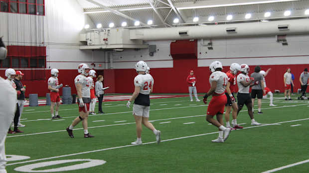 Hunter Wohler and Darryl Peterson walk between drills during practice.
